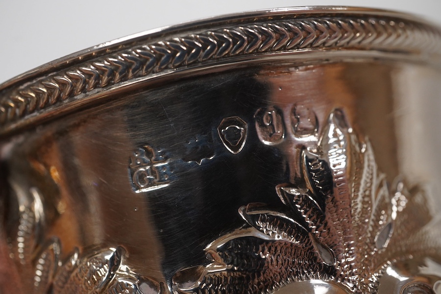 A cased William IV embossed silver pedestal christening mug, with engraved monogram, by Pearce & Burrows, London, 1831, height 77mm, 3.4oz. Condition - fair